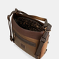 Esta é a peça perfeita para a mulher que valoriza versatilidade sem abrir mão do estilo.

Com um design bicolor que combina caramelo e castanho escuro, esta bolsa destaca-se pelos detalhes em relevo inspirados na coleção Voyage — motivos florais, silhuetas femininas e a inconfundível assinatura da marca gravada no material — conferindo-lhe uma personalidade única e intemporalmente sofisticada.