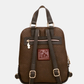 Uma mochila que eleva o conceito de acessório funcional a verdadeira peça de autor.

O seu exterior apresenta um padrão em patchwork com texturas e motivos em tons de verde-musgo, castanho, terracota e dourado, com apontamentos florais e geométricos que evocam a riqueza dos tecidos artesanais. A assinatura Anekke em lettering dourado, os detalhes em metal dourado e o pendente com logótipo completam um design sofisticado e inconfundível.