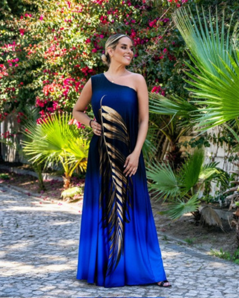 Este vestido é perfeito para momentos especiais e dias ensolarados, combina conforto e elegância de forma inigualável.  O modelo de um ombro só, com um tecido leve e fluido, cria um visual sofisticado e moderno, ideal para festas, casamentos ao ar livre, jantares especiais ou férias tropicais. Este vestido é uma escolha versátil que a deixará deslumbrante em qualquer ocasião.  Um must-have para qualquer guarda-roupa que preza pela elegância e estilo natural.